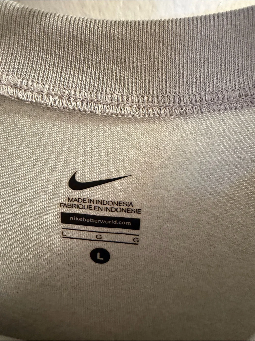 Nike Light Gray Long Sleeve Athletic Top with Black Swoosh